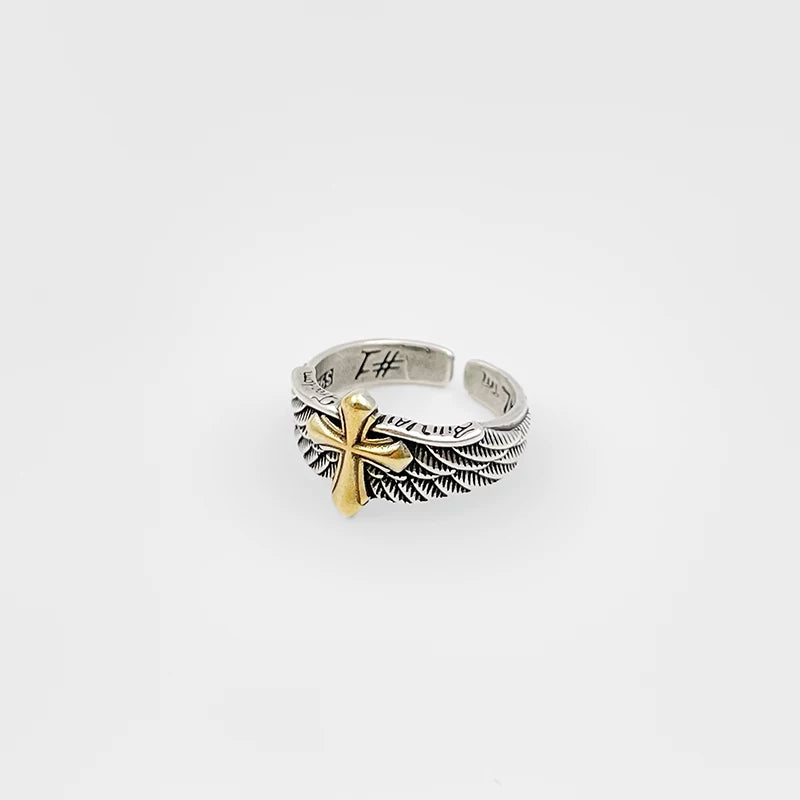 Dark retro winged cross ring