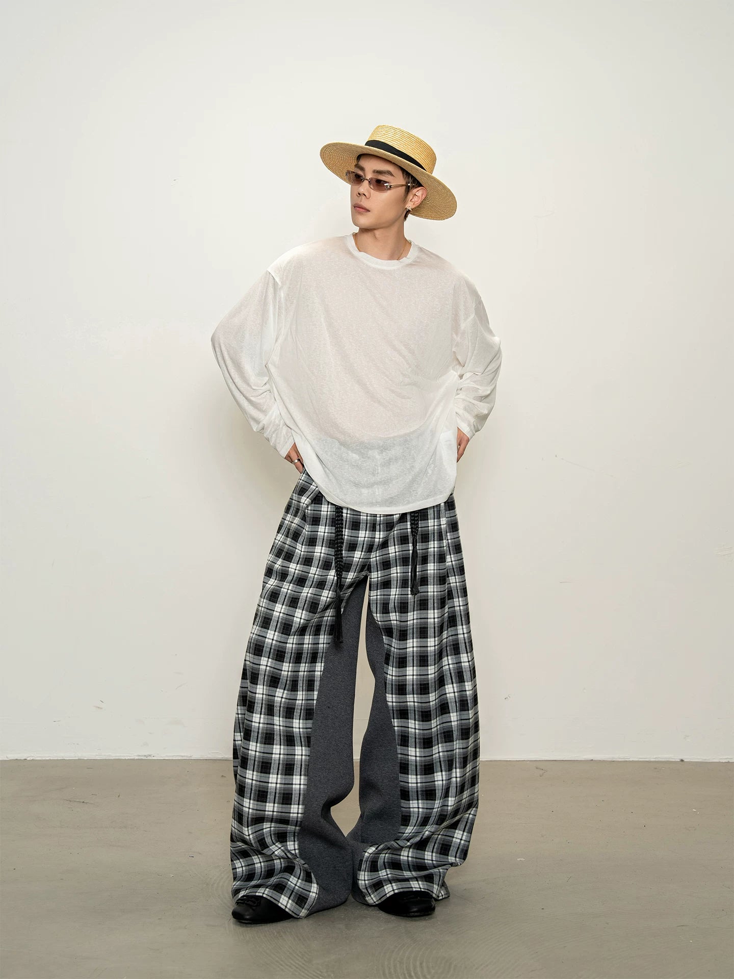 Effortless chic: black and white plaid patchwork casual pants - deconstructed, versatile, and relaxed wide-leg trousers